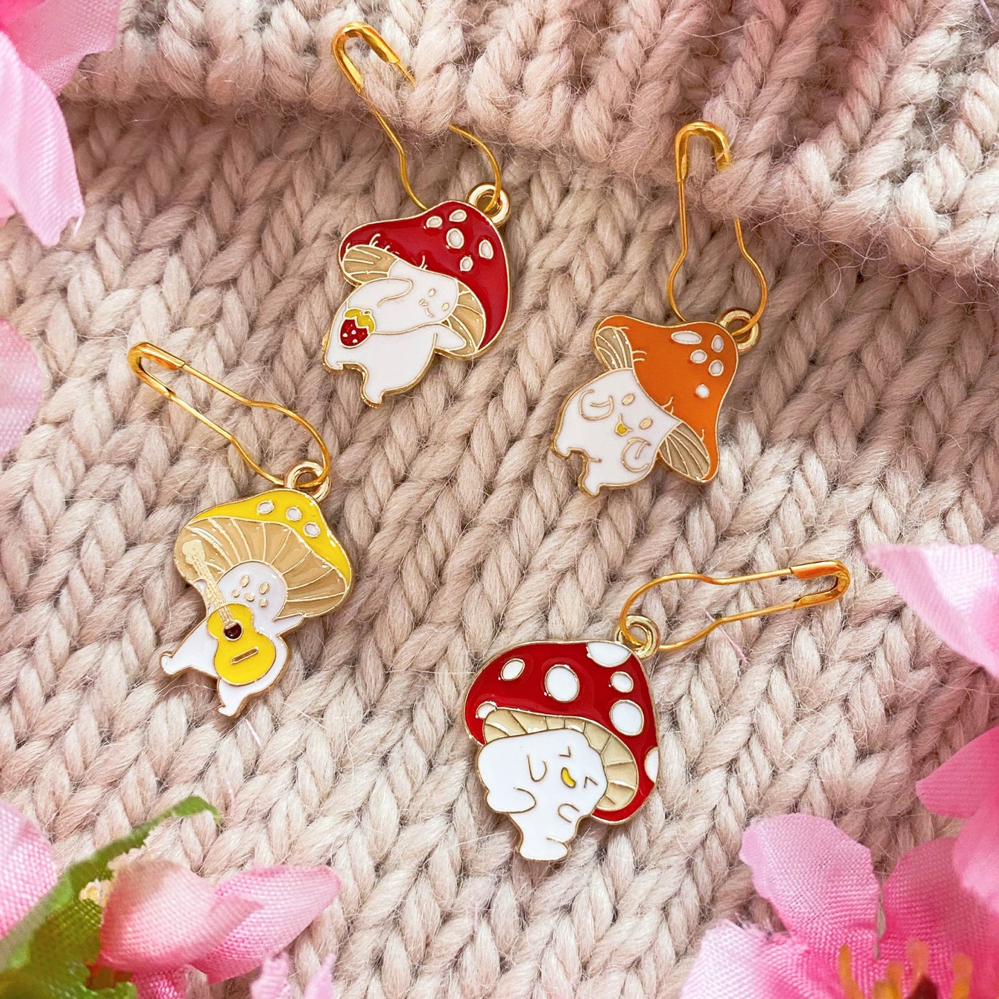 Happy Mushroom Stitch Markers Set – Whimsical stitch markers with cheerful mushroom designs for knitting and crochet.