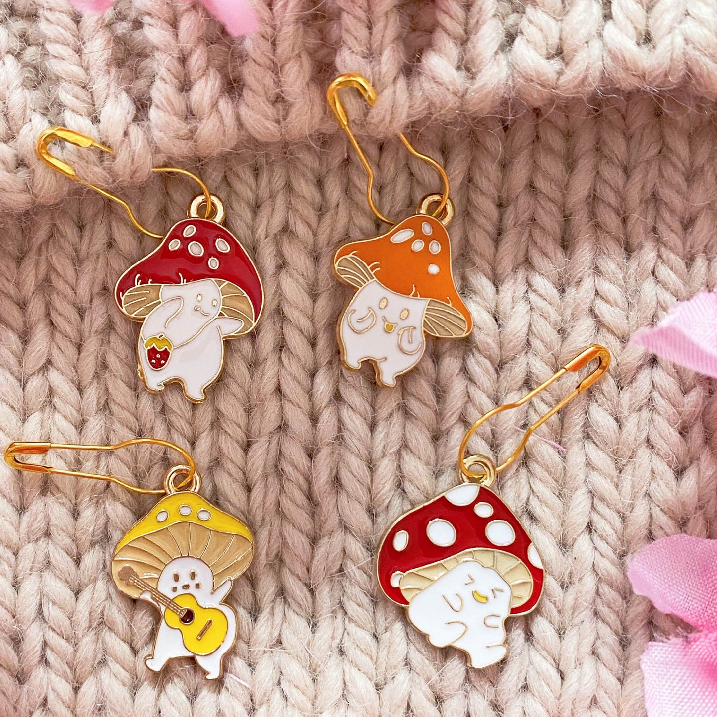 Whimsical Mushroom Stitch Markers for Autumn Lovers – Cute enamel mushroom markers for marking knitting progress in fall-inspired designs.