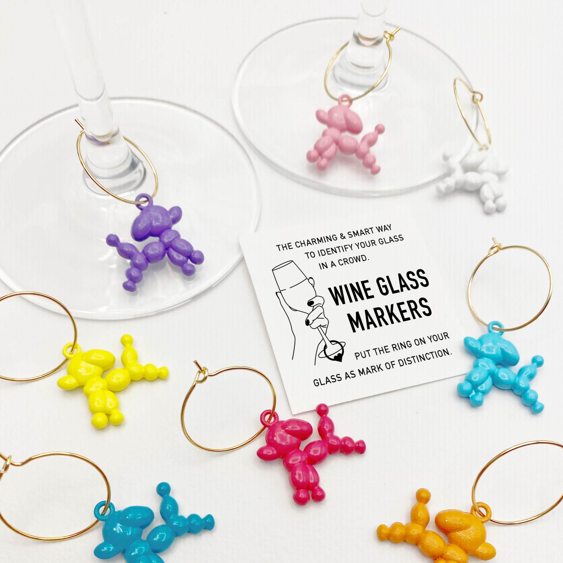 Set of 8 Pop Art Balloon Dog Wine Charms – Colorful poodle-inspired wine markers for parties and gatherings.